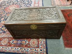 A carved Eastern camphor wood chest,