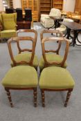 A set of four early 20th century beech dining chairs