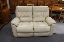 A Laz-y-Boy cream leather two seater settee