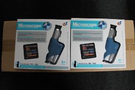 Twenty boxed educational microscopes