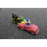 Two cast iron figures - Donald Duck, Pluto in car,