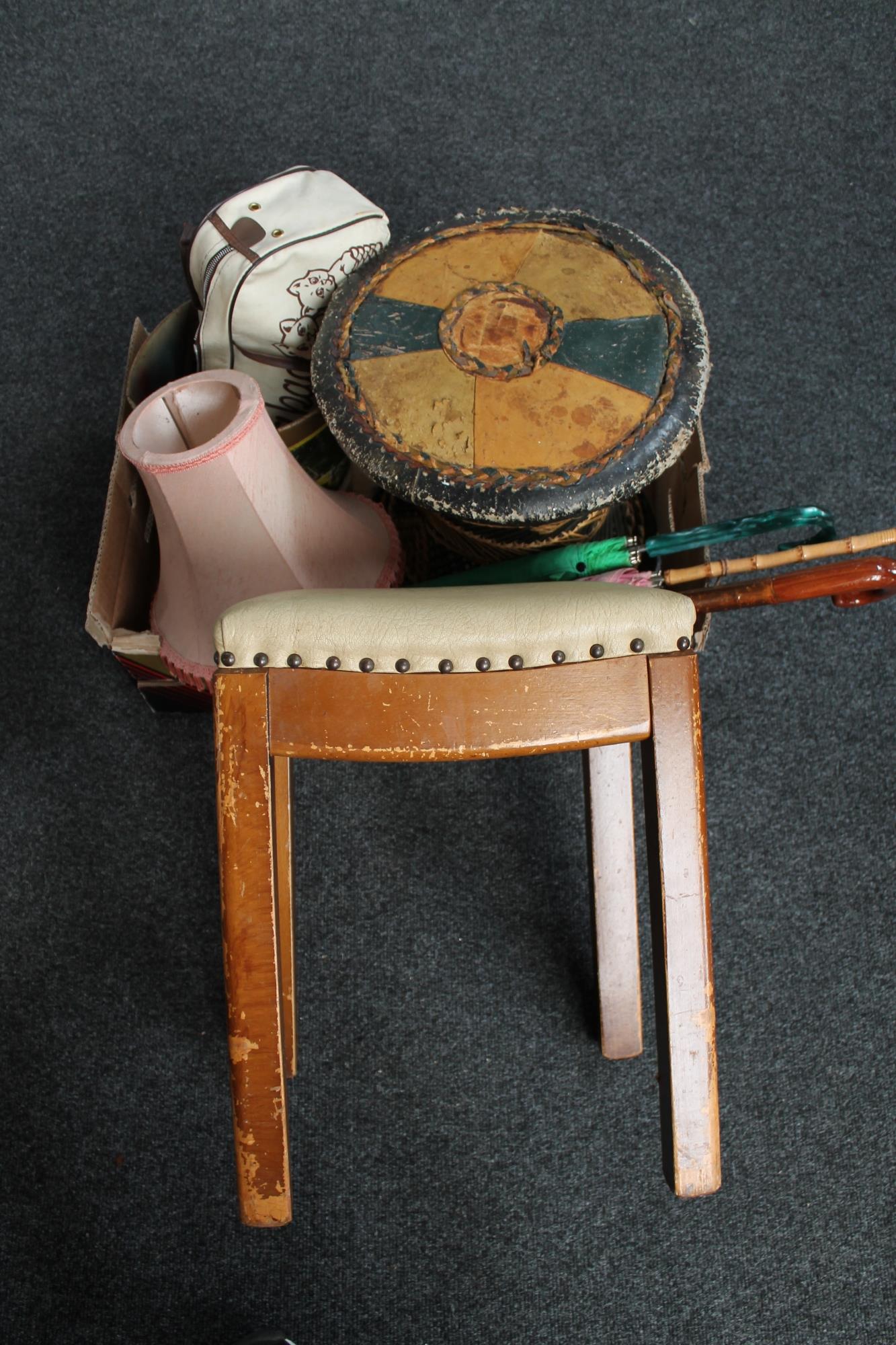 Three 20th century vinyl upholstered stools and box of walking stick, parasol,