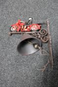 A cast iron vintage motorbike bracket with bell