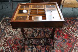 A Victorian mahogany work table with fitted interior (no top)