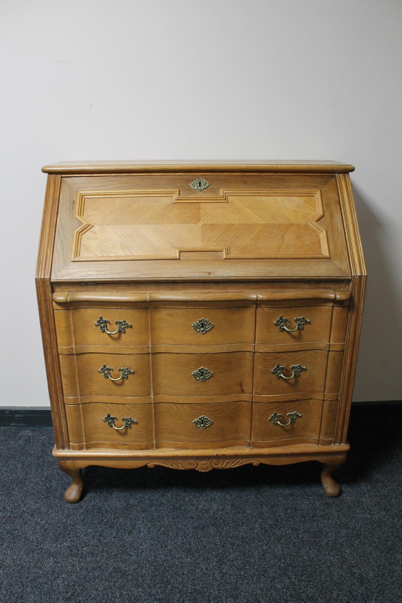 A blonde oak bureau