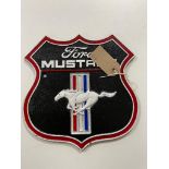 A cast iron plaque - Ford Mustang