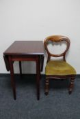 A Victorian mahogany balloon back chair and a drop leaf kitchen table
