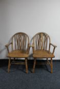 A pair of Windsor style carver armchairs