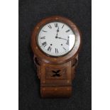 An antique inlaid mahogany wall clock with circular dial