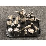 A tray of silver plated pheasant ornaments, condiments, set of four goblets,