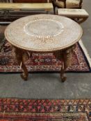 An early 20th century Anglo Indian ivory inlaid elephant table,