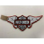 A cast iron plaque - Harley Davidson cycles