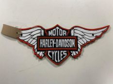 A cast iron plaque - Harley Davidson cycles