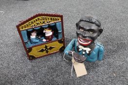 A cast iron Punch and Judy novelty money box together with one other