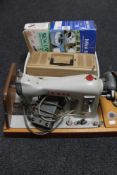 A cased Jones electric sewing machine,
