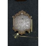 A 20th century continental oak wall clock,