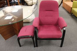 A late 20th century adjustable armchair with footstool in purple fabric