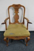 An early 20th century oak armchair