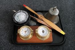 A tray of ship's compass, ship's bell, brass cased barometer and clock mounted on board,