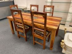 A sheesham wood dining room table and five chairs,