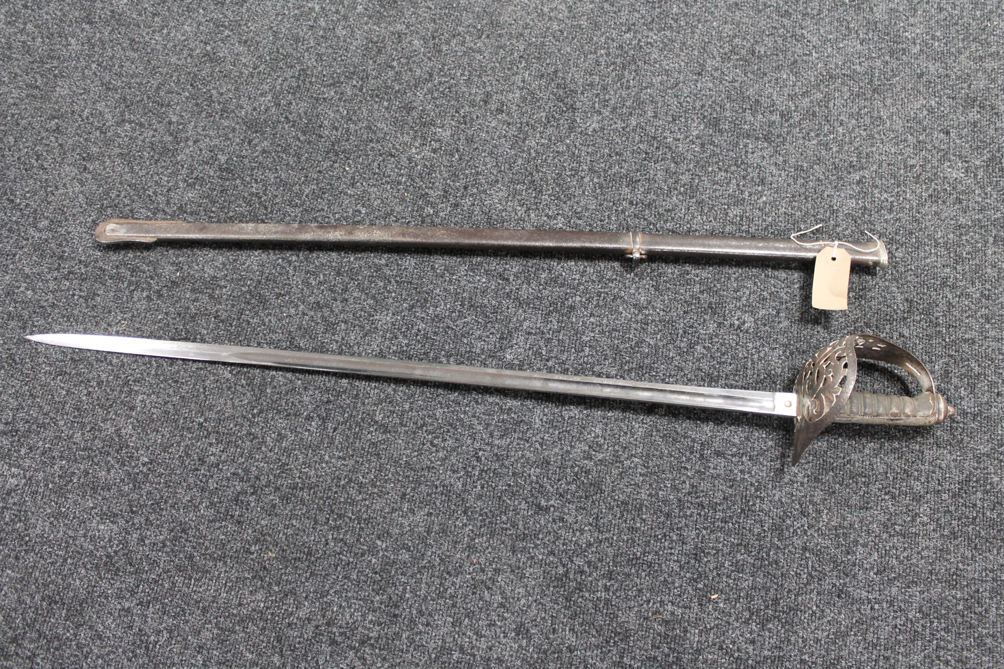 A British infantry officer's sword in sheath CONDITION REPORT: Blade and scabbard a