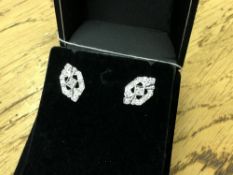 A pair of 10ct white gold diamond set earrings
