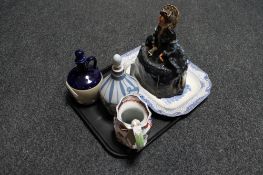 A glazed pottery figure of Queen Victoria, antique blue and white meat plate,