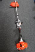 A petrol garden strimmer