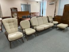 A five piece Ercol lounge suite (three seater settee, two armchairs,