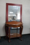 A shaped hall table and a hall mirror