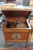 An oak cased 1930's gramophone and a box of 78's