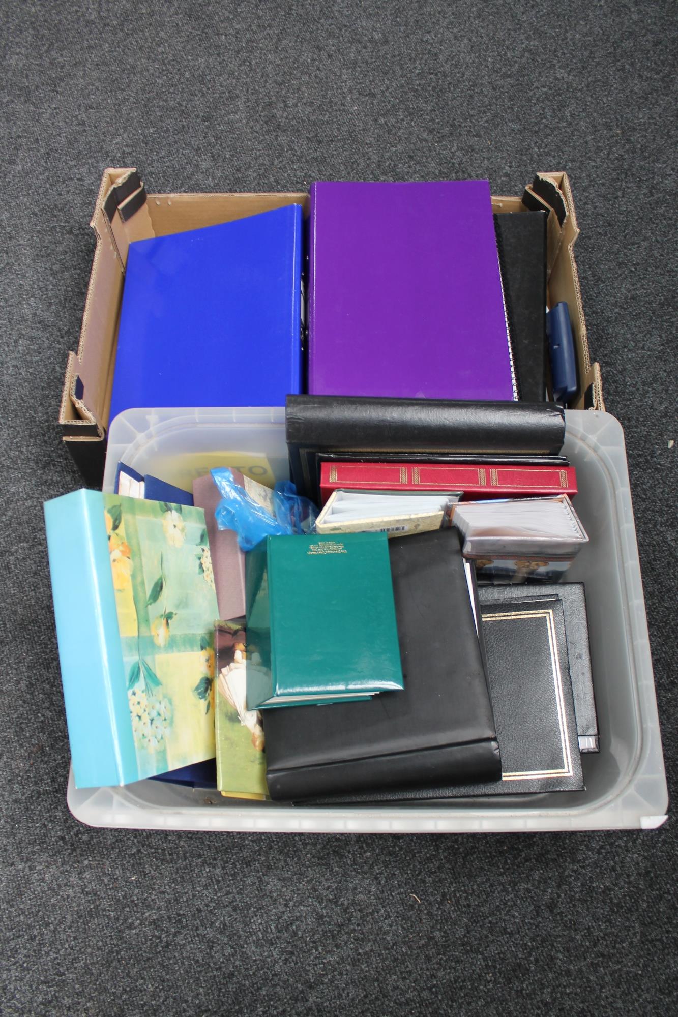 Two boxes of photograph albums, files, hole punch,