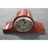 An antique mahogany Westminster chime mantel clock with silvered dial on raised feet