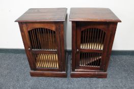 A pair of Eastern hardwood bedside cabinets