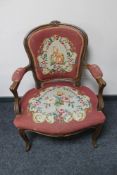 A beech framed armchair in tapestry fabric