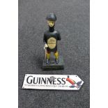 A cast iron Guinness Good for Him and Good for You Jockey money box together with a cast iron