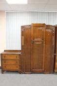A 1930's oak single door wardrobe and matching three drawer chest