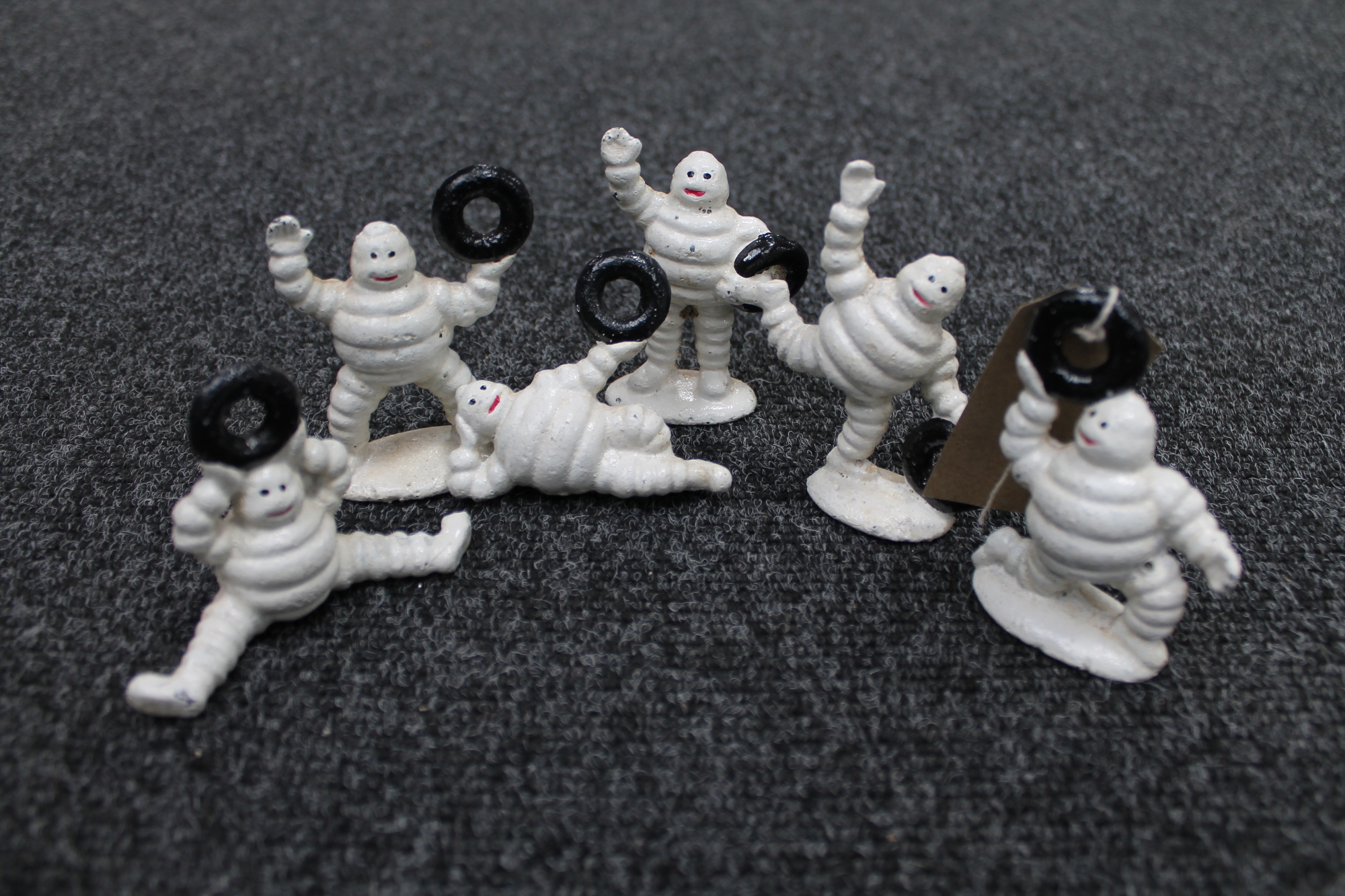 Six cast iron figures of Michelin Men