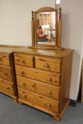 A pine five drawer chest with vanity mirror