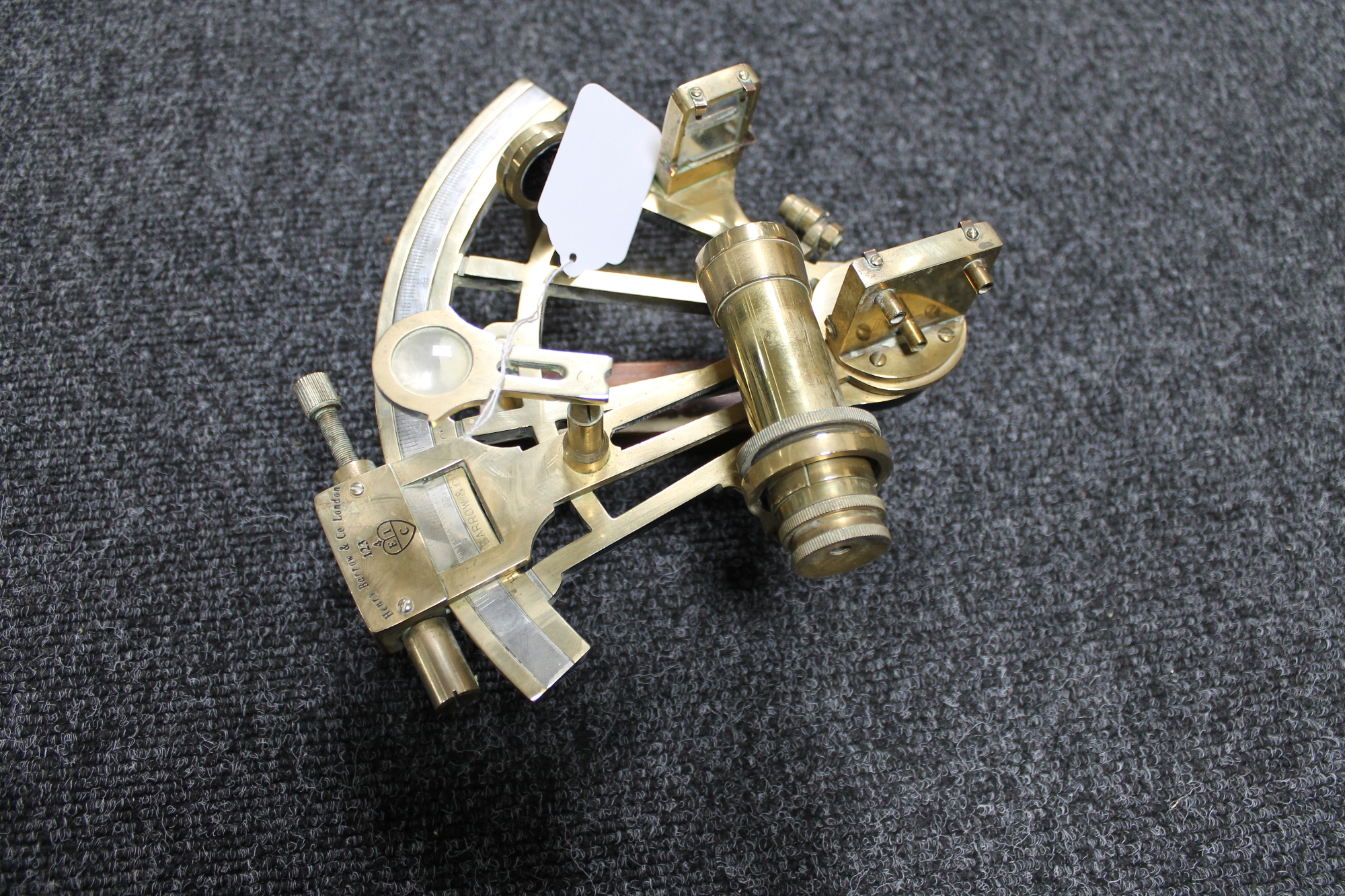 A brass sextant stamped Henry Barrow & Co London
