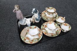 A tray of two Nao figures and six antique china trios