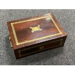 A mahogany and brass inlaid table box with key