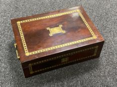 A mahogany and brass inlaid table box with key