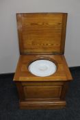 An antique pine commode box