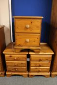 A pair of pine bedside chests and two drawer chest