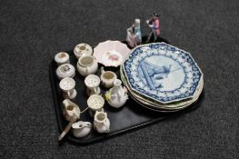 A tray of crested china, wall plates, continental figures,