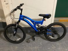 A boy's Muddyfox Radar full suspension bike
