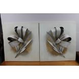 A pair of contemporary wall art panels depicting metal flowers