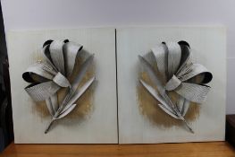 A pair of contemporary wall art panels depicting metal flowers