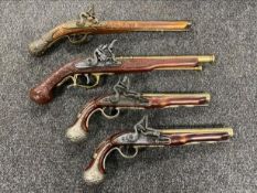 A box of four replica flintlock pistols CONDITION REPORT: Postage quote UK £15 + vat.